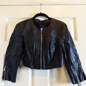 Small black bebe jacket.  looks like leather.